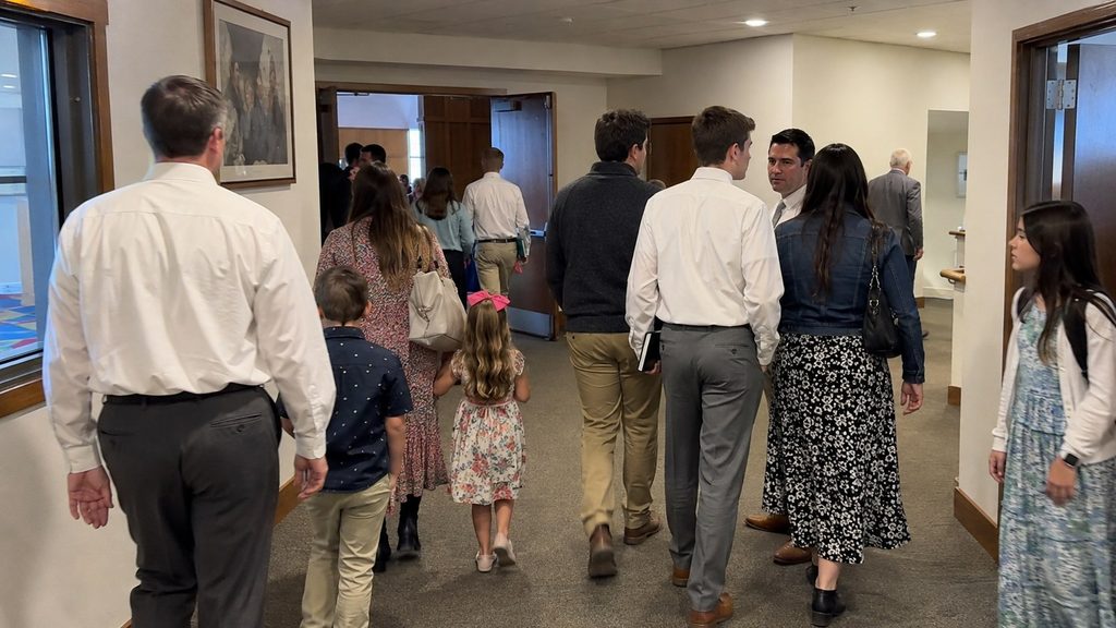 Families and church members walking to classes after sacrament meeting