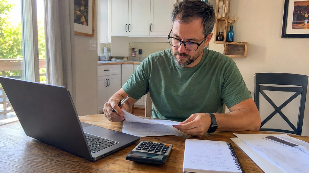 Latter-day Saint member reviewing income while considering gross or net tithing