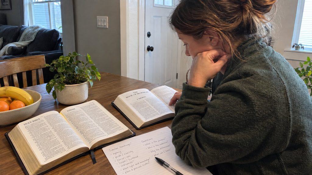 A Latter-day Saint studying the Bible and the Book of Mormon while comparing teachings about Jesus Christ