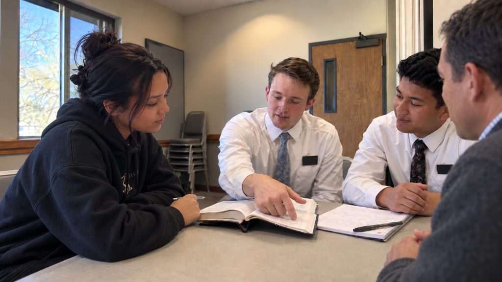 Young adult preparing for LDS baptism with missionaries