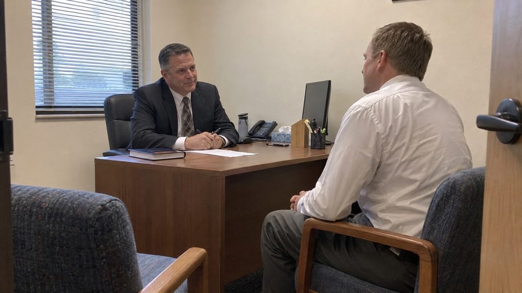 Latter-day Saint member discussing a Church calling with a local Church leader